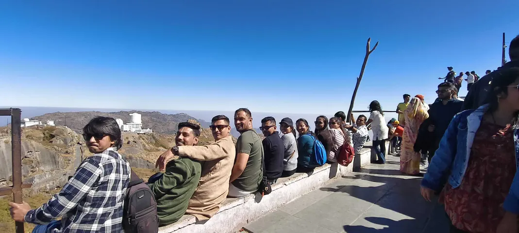 The team on a hilltop viewpoint during the yearly office trip