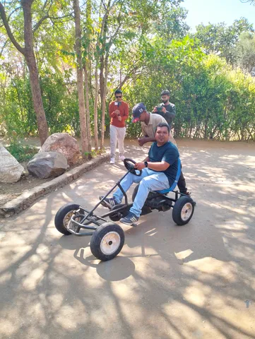 A team member go-karting on the yearly office trip