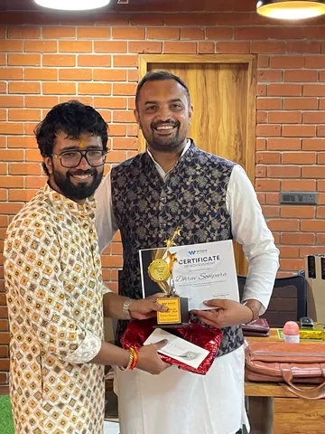 A team member receiving the Employee of the Year award