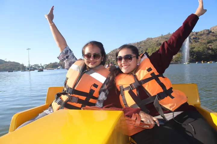 Team members enjoying a boat ride on the office trip