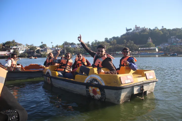 The team on a paddle boat during the yearly office trip